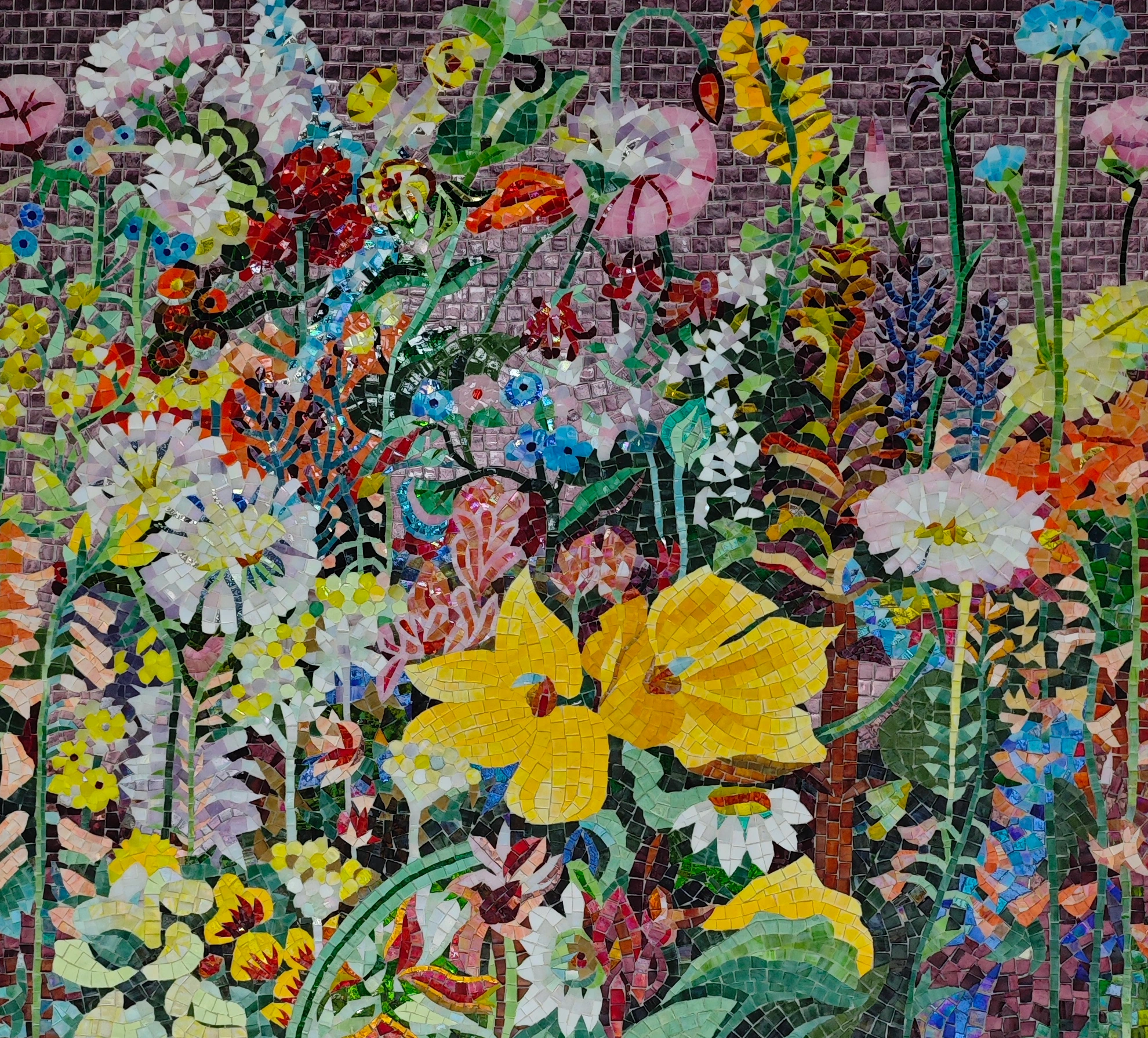 Colorful flowers and leaves formed from hand-cut mosaic pieces